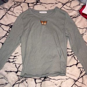 green skin tight long sleeve with butterfly